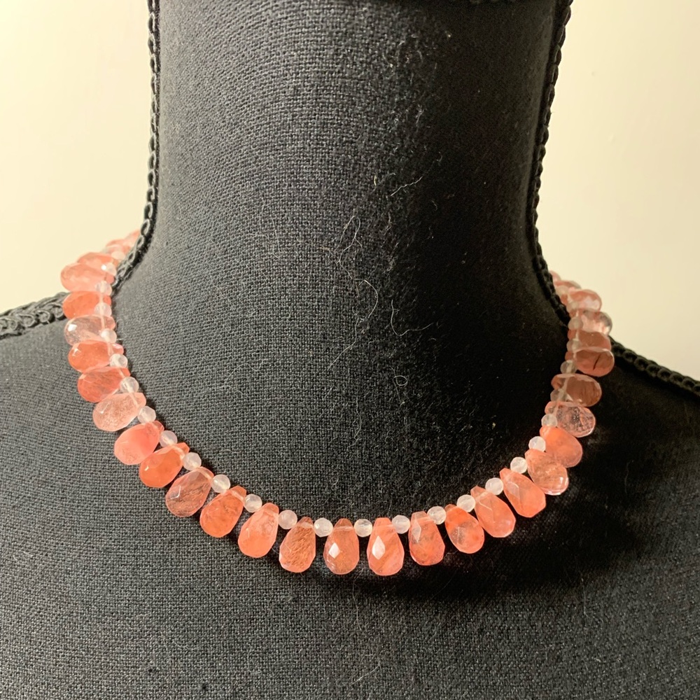 Pink strawberry quartz pear shaped faceted bead necklace.Sterling clasp Read